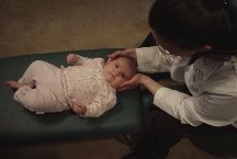 Mary Psaromatis adjusting baby